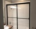 Glass shower with black frames