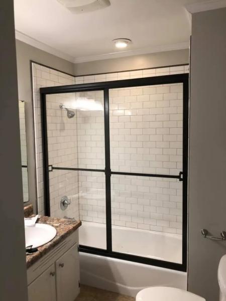 Glass shower with black frames