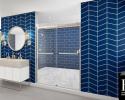 Bathroom with modern blue tile and large glass shower